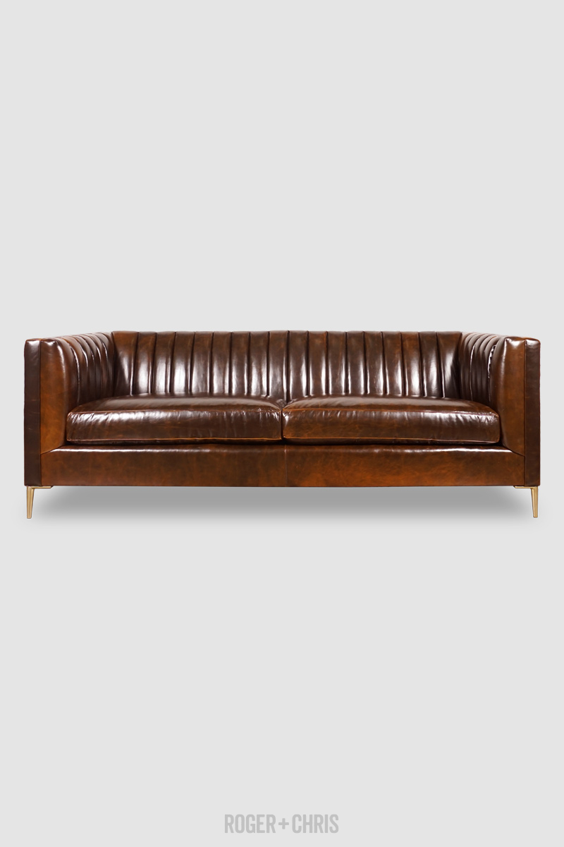 Channel tufted deals leather sofa